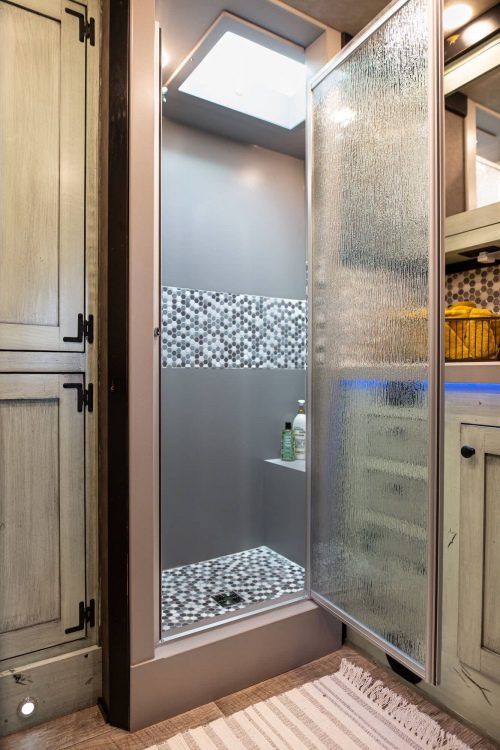 1492 Coachworks Toy Hauler Bathroom Solid Surface and Tile Shower